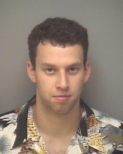 Virginia forward arrested on Sunday with a classic mugshot ...